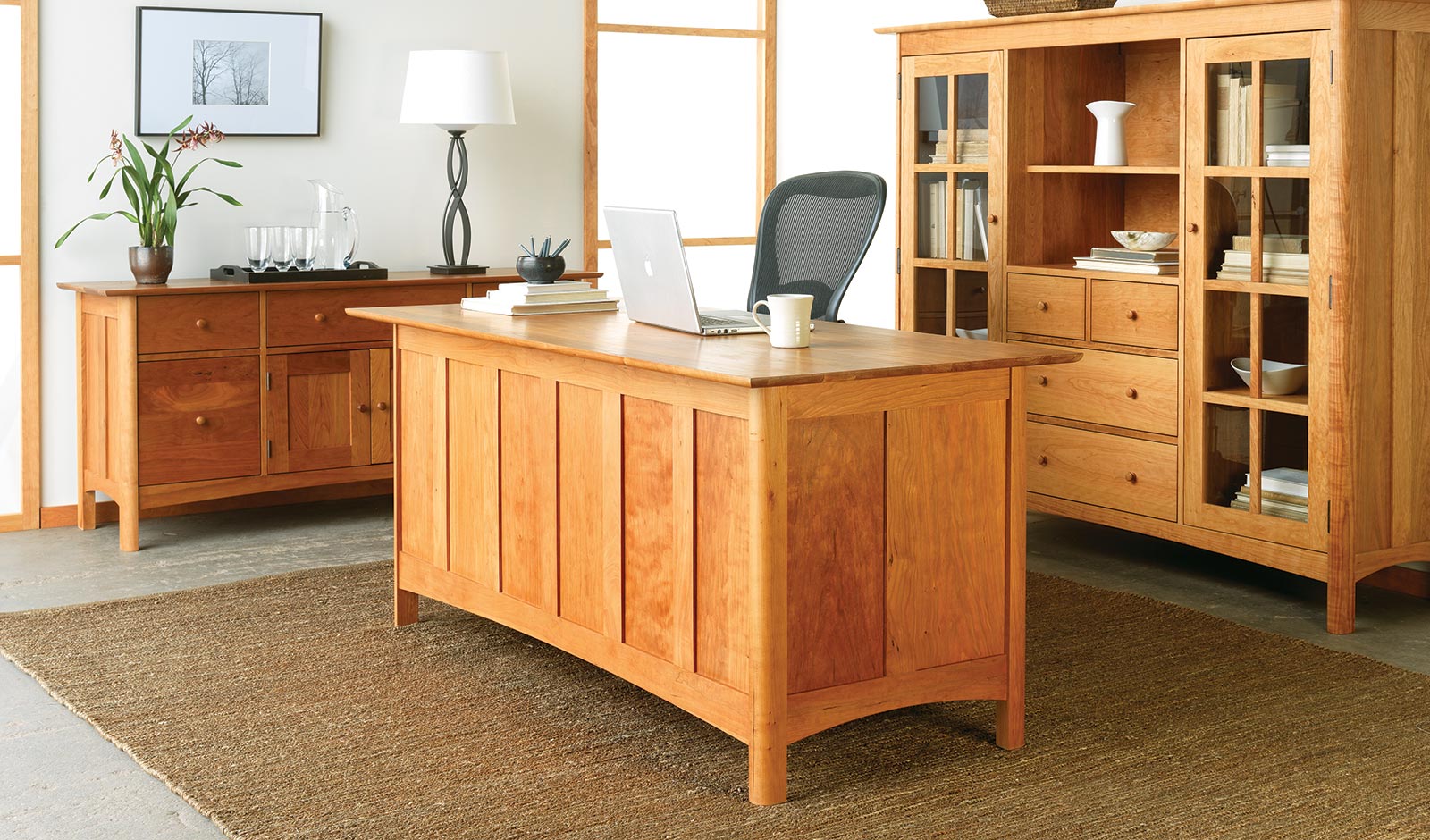 A cherry executive desk with matching storage pieces from Vermont Furniture Designs